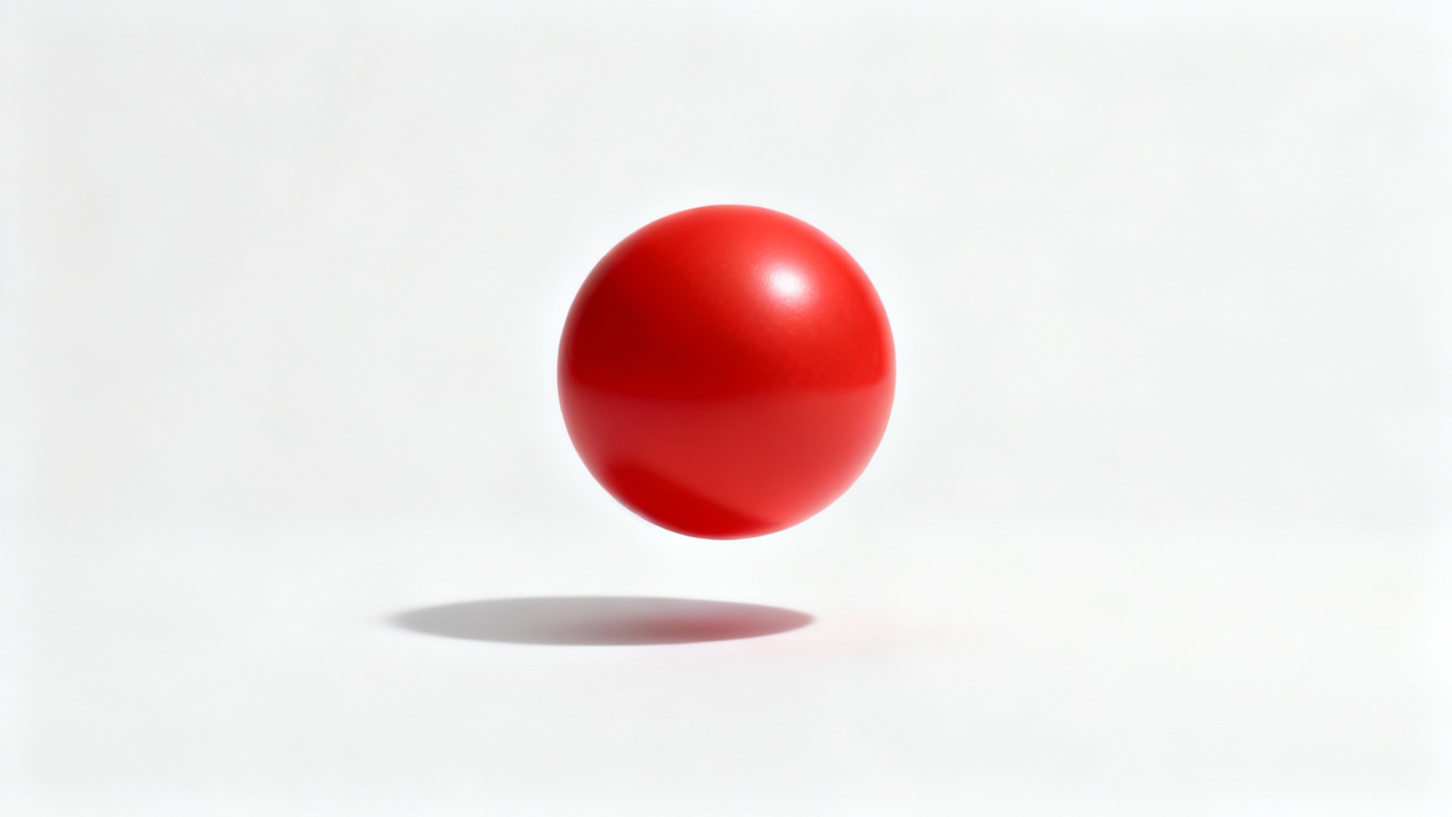 A red sphere hovering over a white surface, casting a distinct and soft shadow, illustrating an add shadow effect.