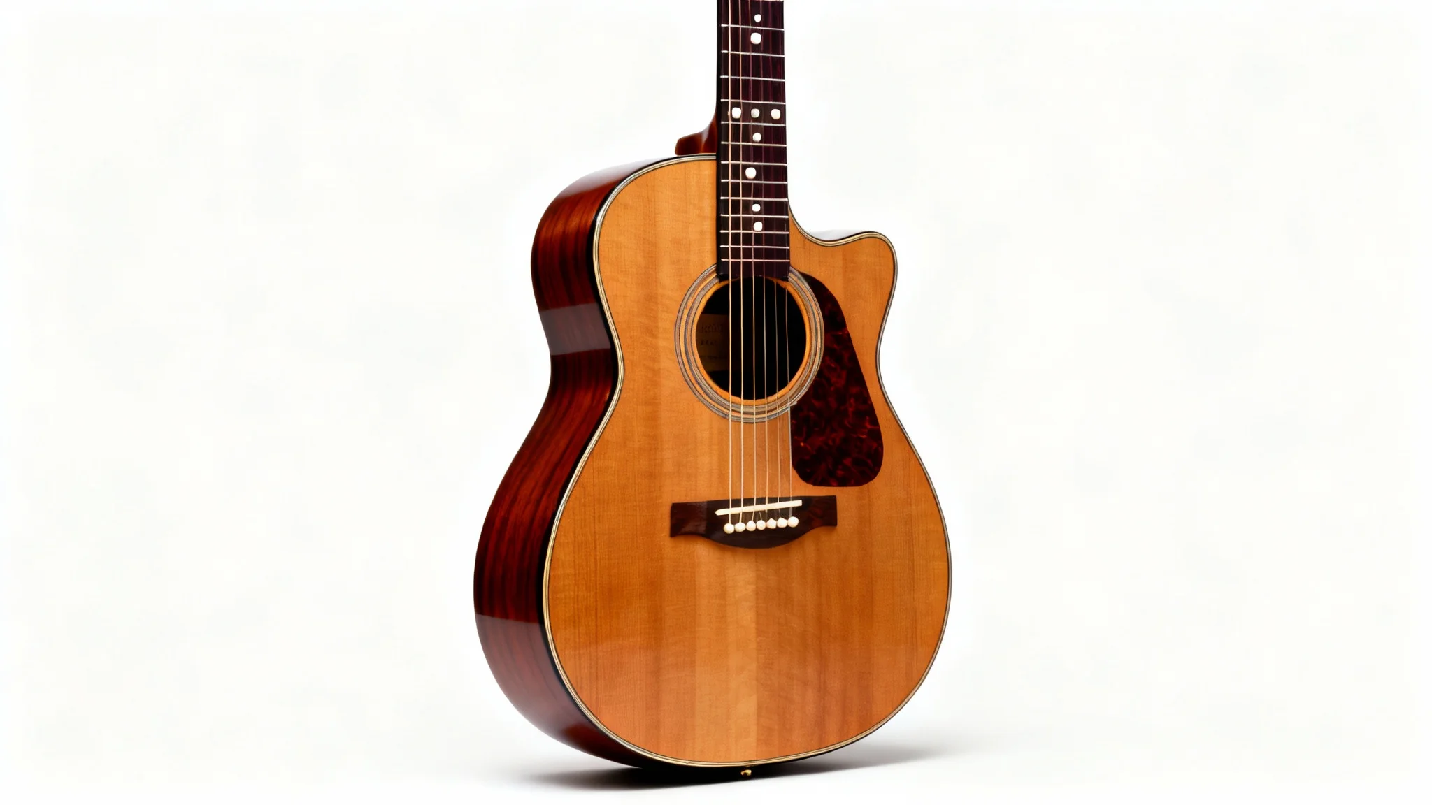 A high-quality acoustic guitar with a natural wood finish, professionally photographed against a plain white background.