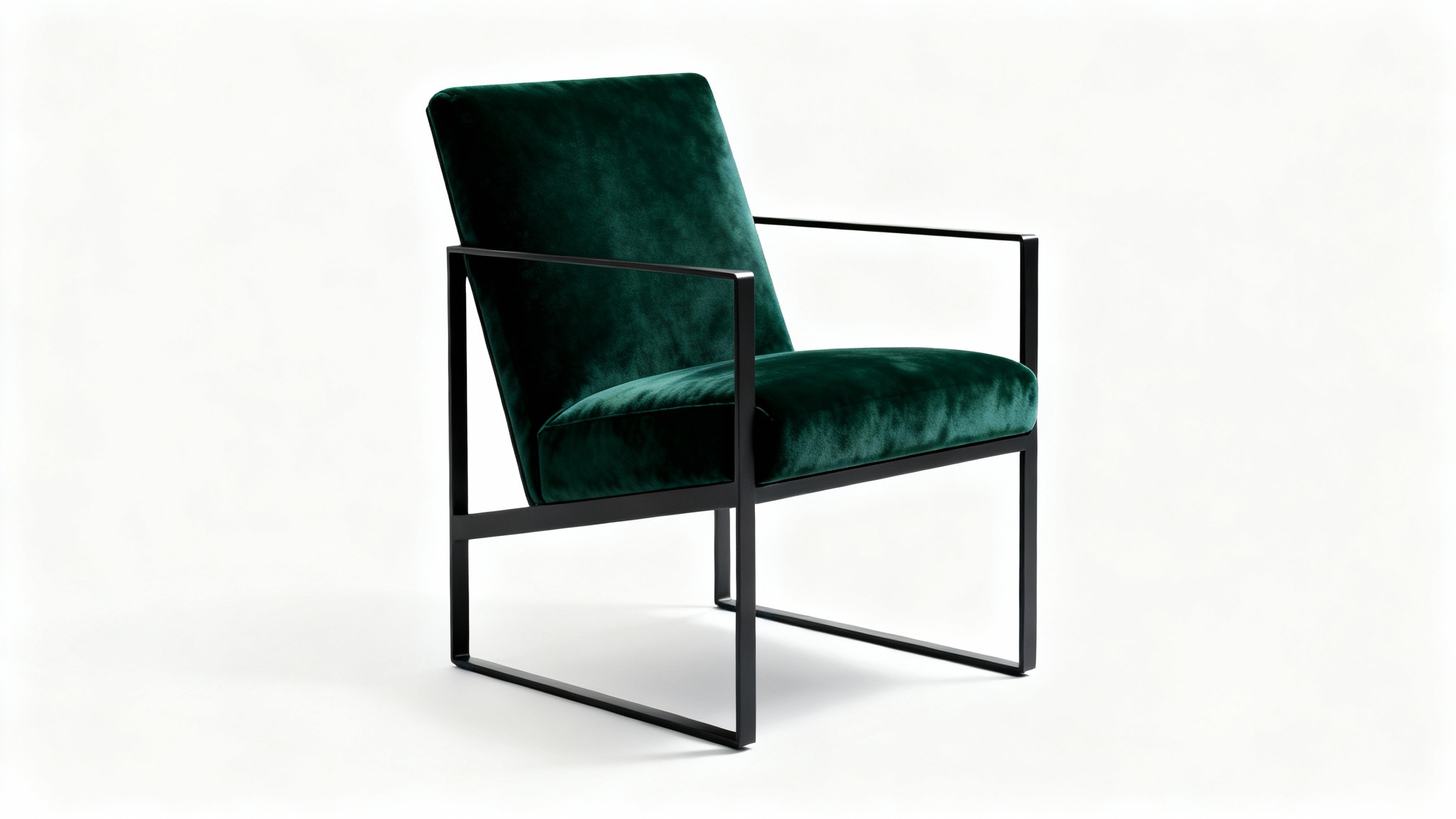 A high-end, modern armchair with a matte black metal frame and luxurious forest green velvet cushions, professionally photographed against a plain white background.