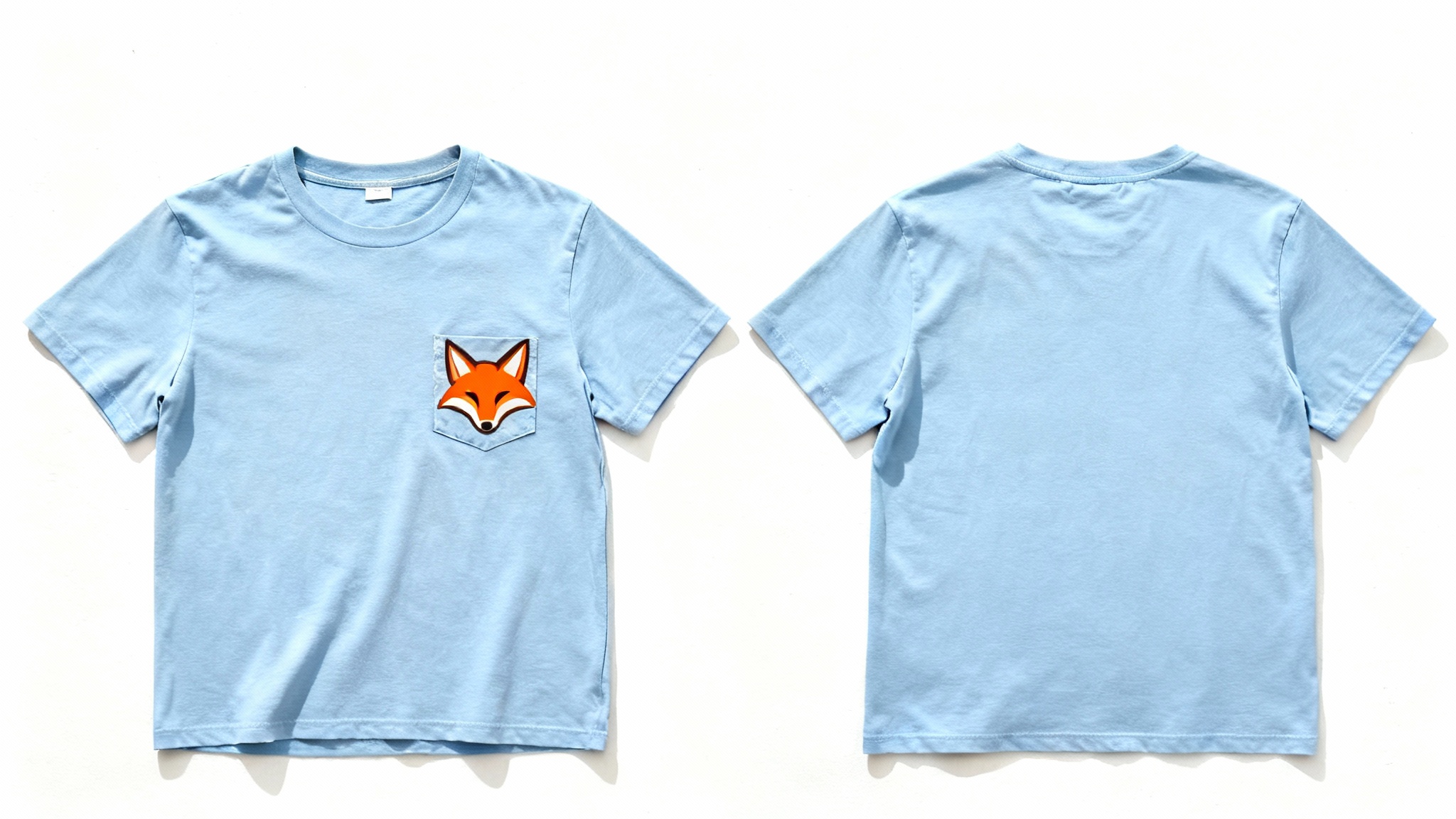 A professional product mockup showing a light blue pocket t-shirt flat-lay. A new, custom-designed orange fox logo is perfectly printed on the pocket, demonstrating the final result of the mockup tool.