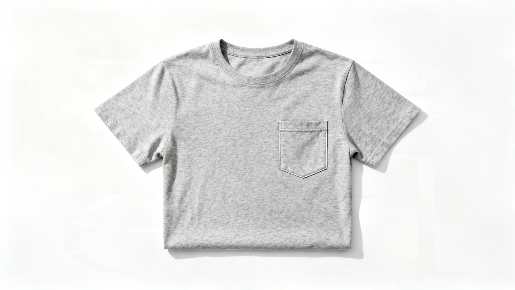 A flat lay, top-down view of a simple heather grey pocket t-shirt mockup on a clean white background, ready for a custom design.