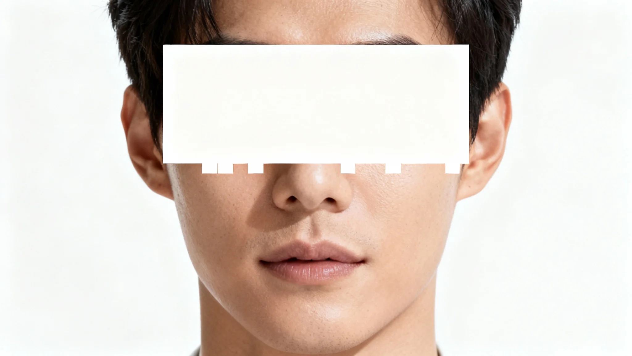 A high-resolution headshot of a person against a white background, with their eyes obscured by a large pixelated block, illustrating a photo censorship feature.