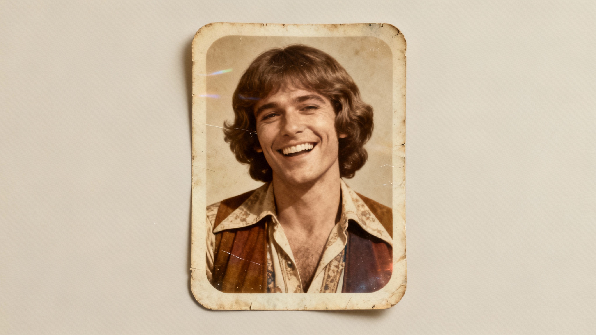 A widescreen hero image displaying the result of a vintage photo effect. The image is a portrait of a person styled in 1970s fashion, transformed to look like an old, faded photograph with sepia tones and film grain.