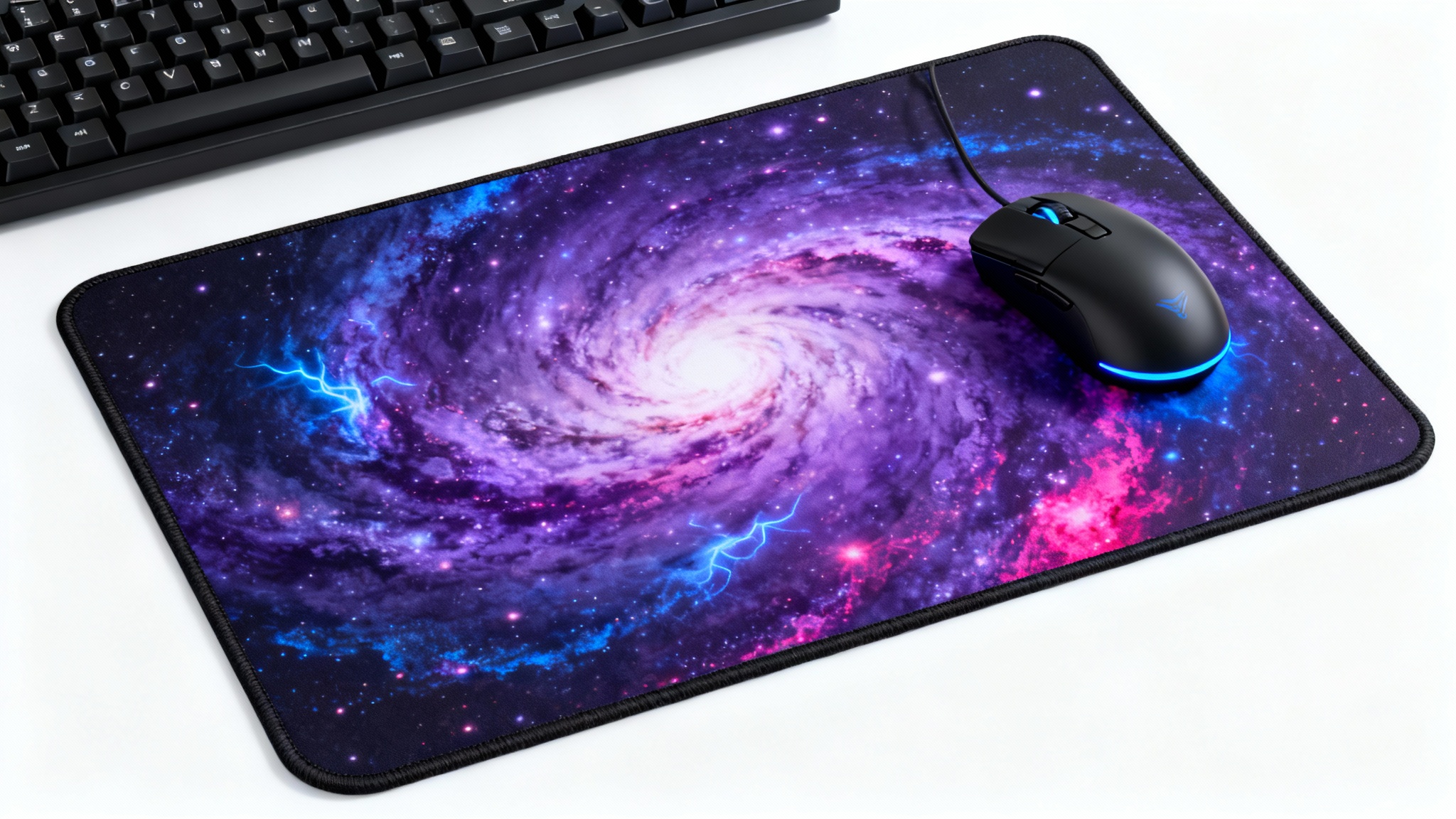 A rectangular gaming mousepad with a vibrant cosmic nebula design, shown with a sleek black gaming mouse on a solid white background.
