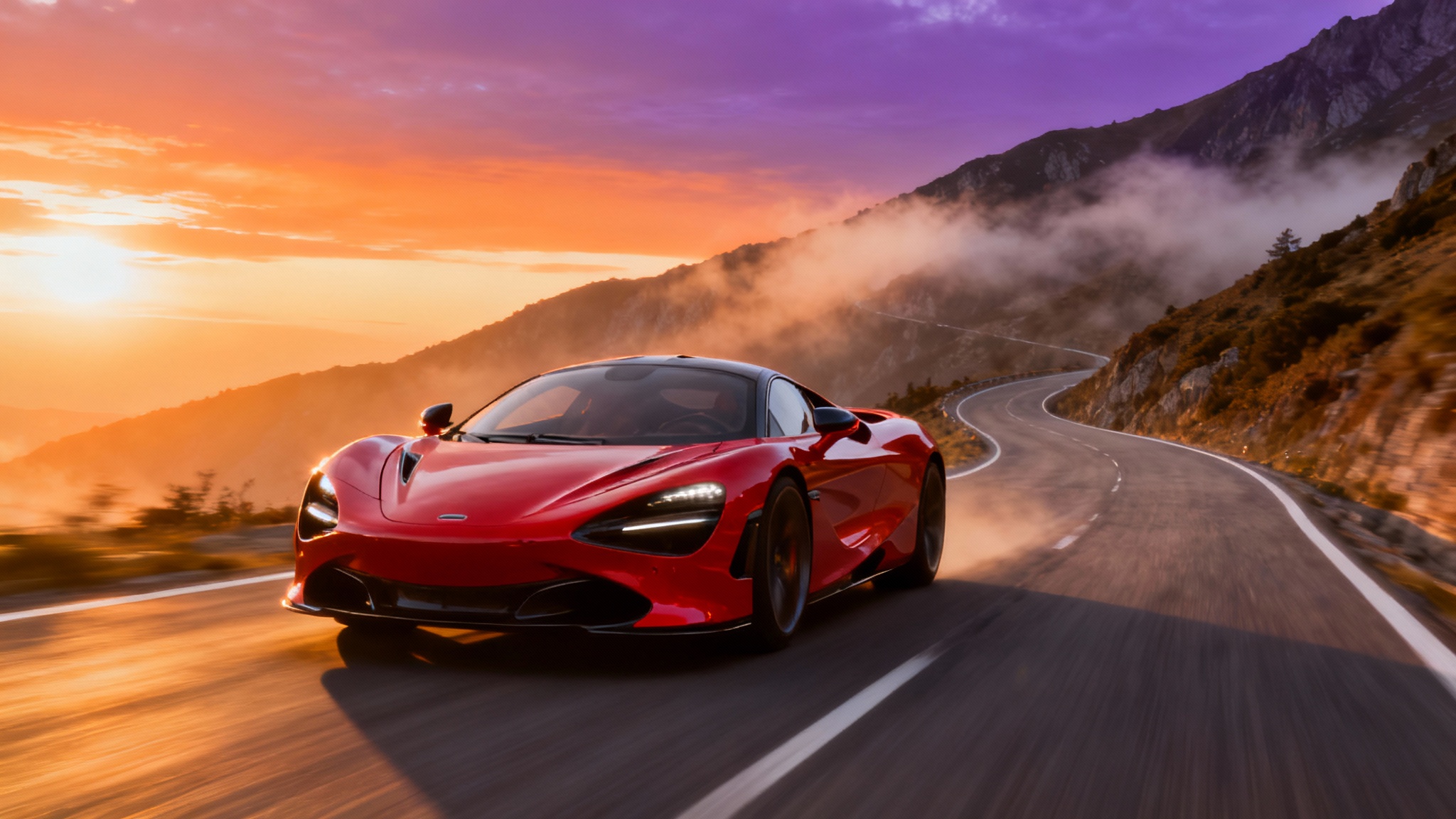 A photorealistic car wallpaper of a red sports car speeding down a scenic mountain road during a beautiful sunset.