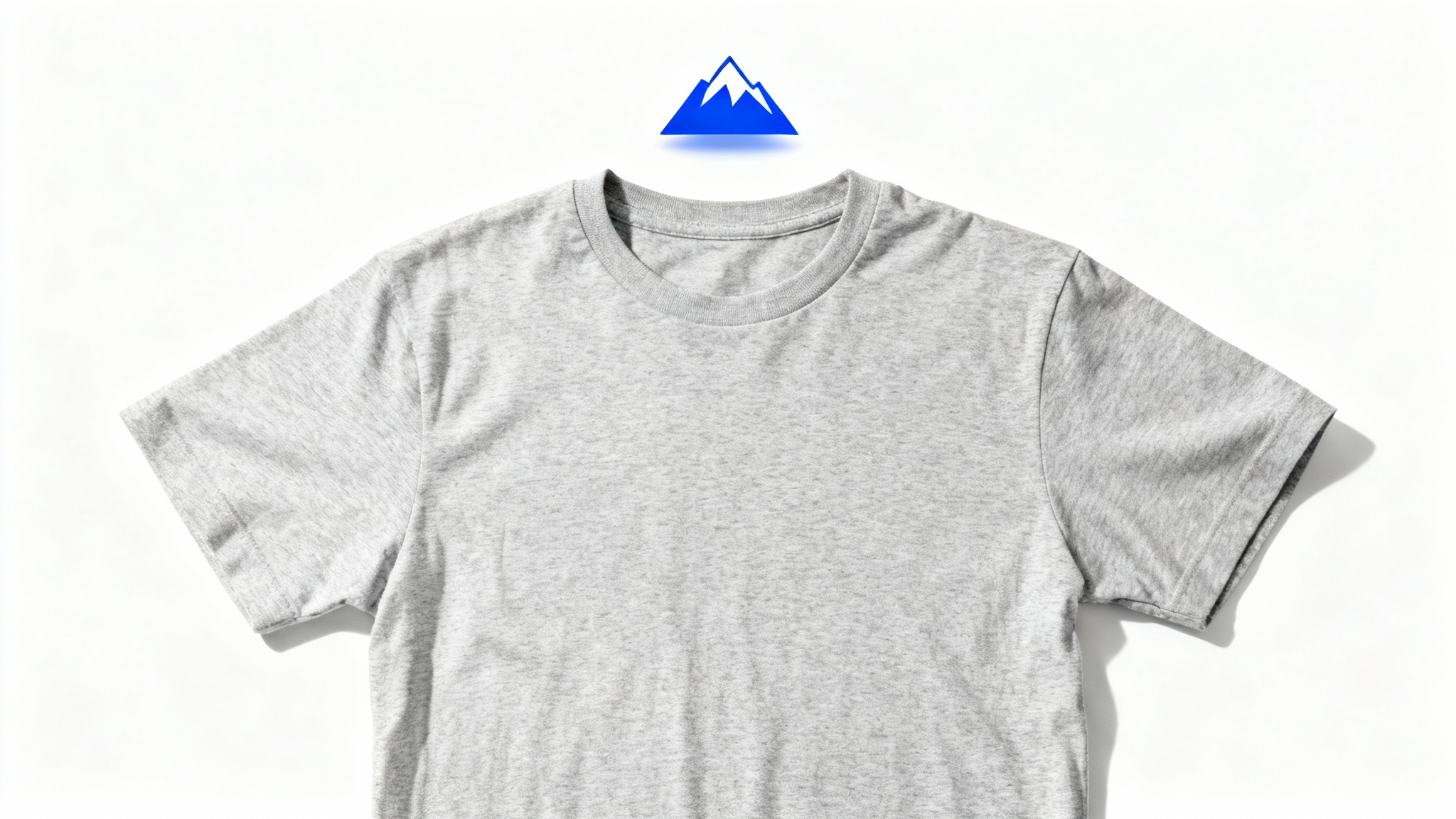 A heather gray t-shirt laid flat on a white background with a blue mountain logo floating just above it, visually representing the concept of extracting a logo from a shirt.