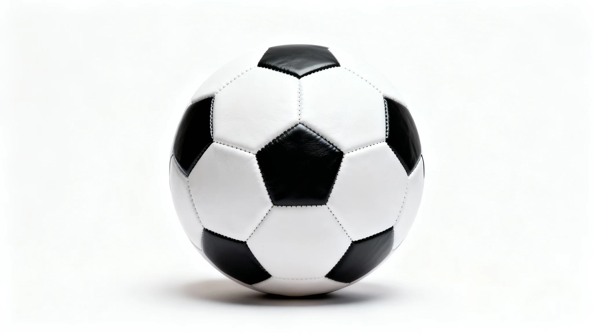 A photorealistic mockup of a classic black and white soccer ball, presented in a clean studio setting with a white background.