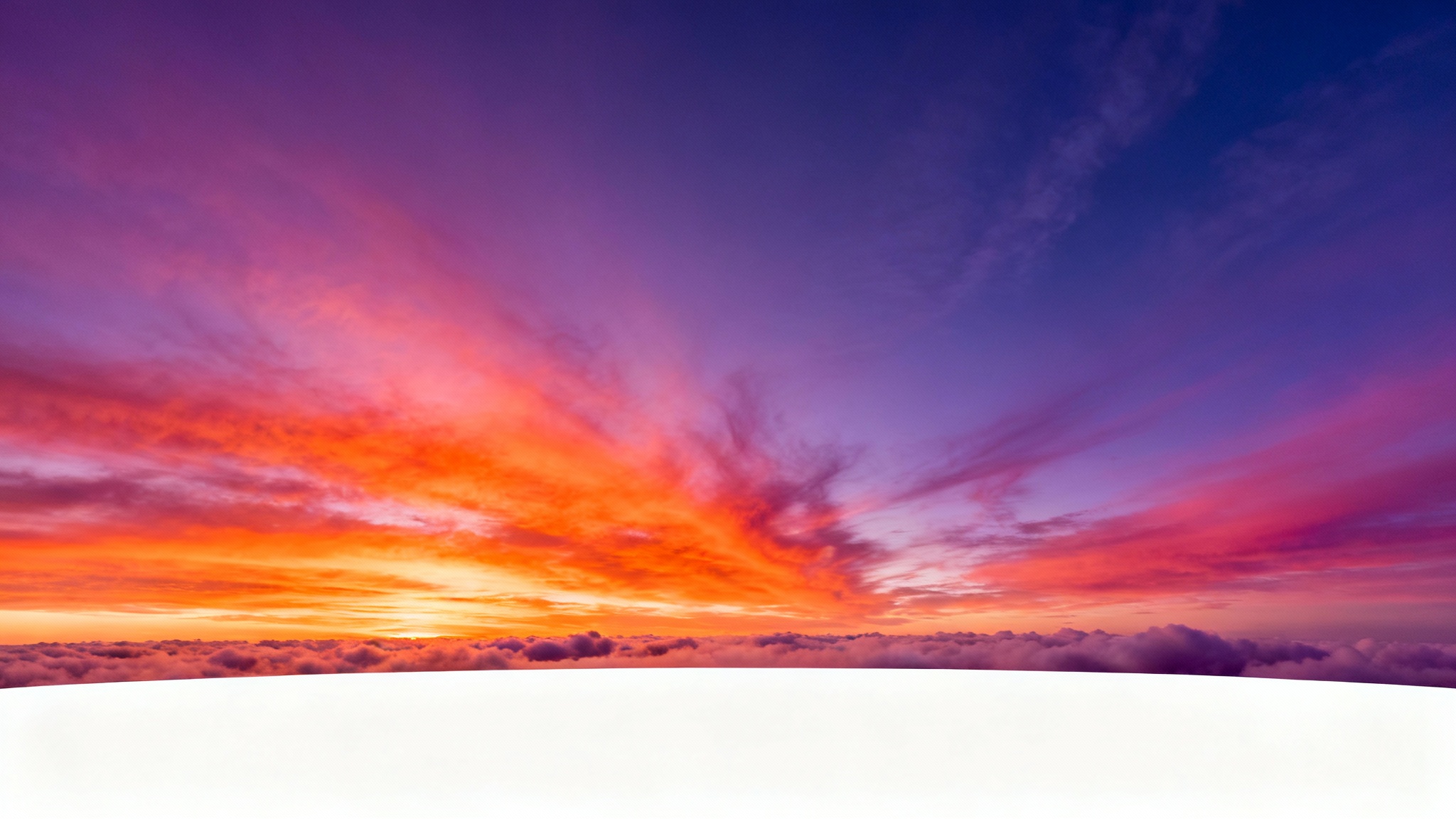 A 360-degree panoramic mockup of a dramatic sunset sky, shown as a flat equirectangular image with vibrant orange, pink, and purple clouds against a deep blue background.