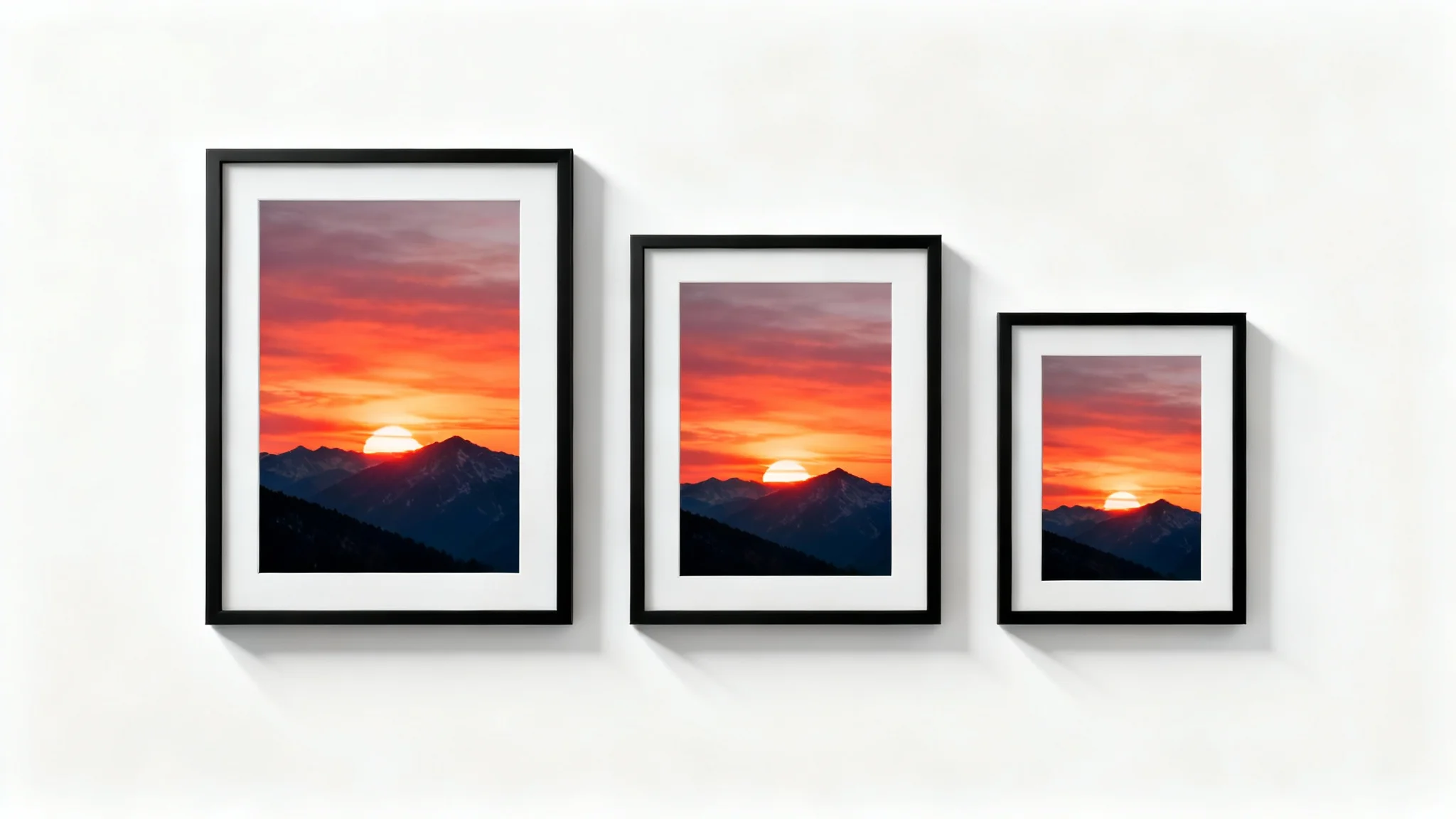 Three black picture frames of varying sizes, large, medium, and small, are lined up on a white background. Each frame contains the same photo of a mountain at sunset, scaled perfectly to fit, illustrating the concept of resizing an image.