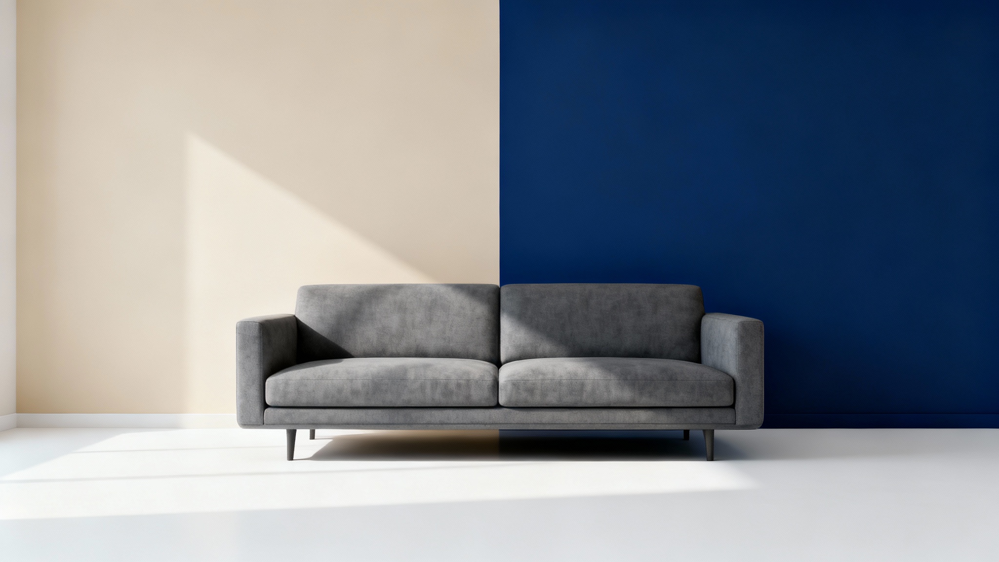 A modern living room interior showing a wall split into two colors; one half is a dull beige and the other is a vibrant navy blue, illustrating the effect of a virtual wall painting tool.