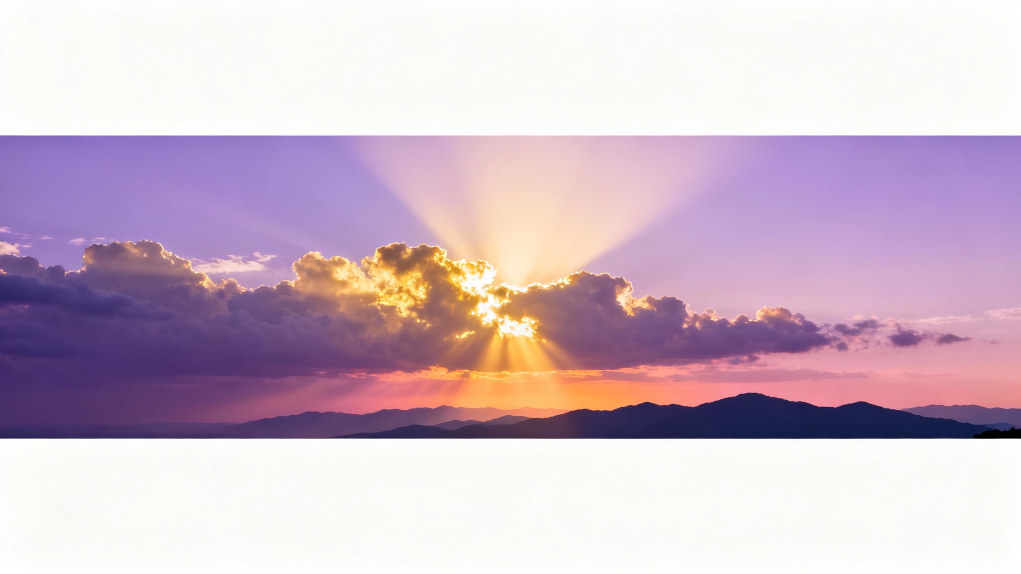 A serene worship background showing golden sunbeams breaking through clouds over a distant mountain range at dawn, creating a peaceful and reverent atmosphere.