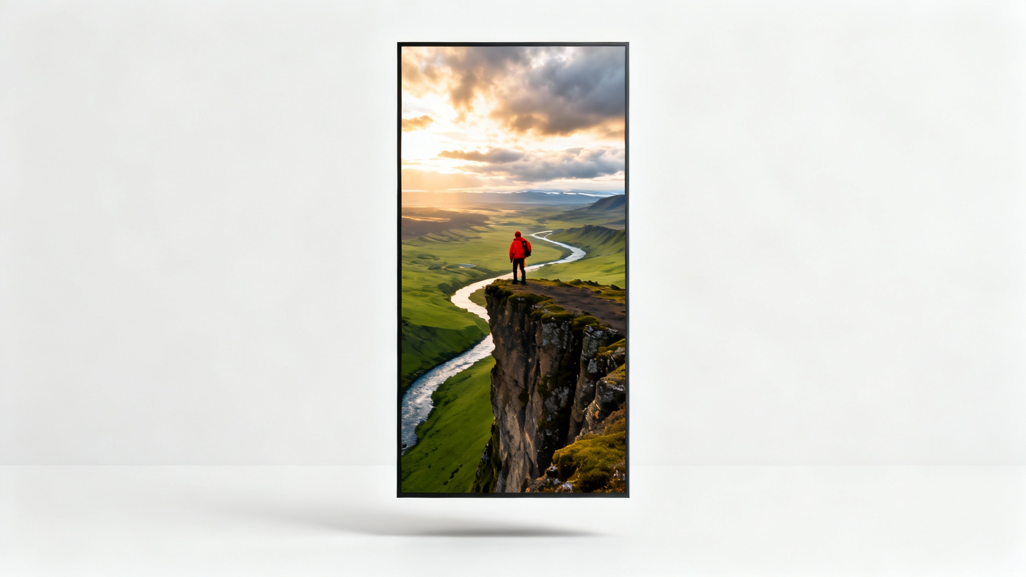 Mockup of a vertical 9:16 video showing an aerial view of a hiker in red on a cliff in Iceland, set against a clean white background.