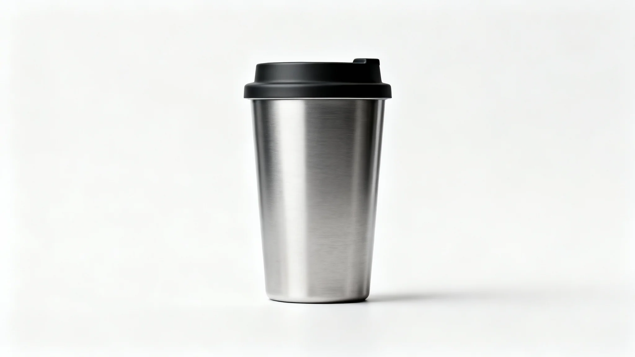 A sleek stainless steel travel mug with a black lid, shown in a professional product photograph against a clean white background.
