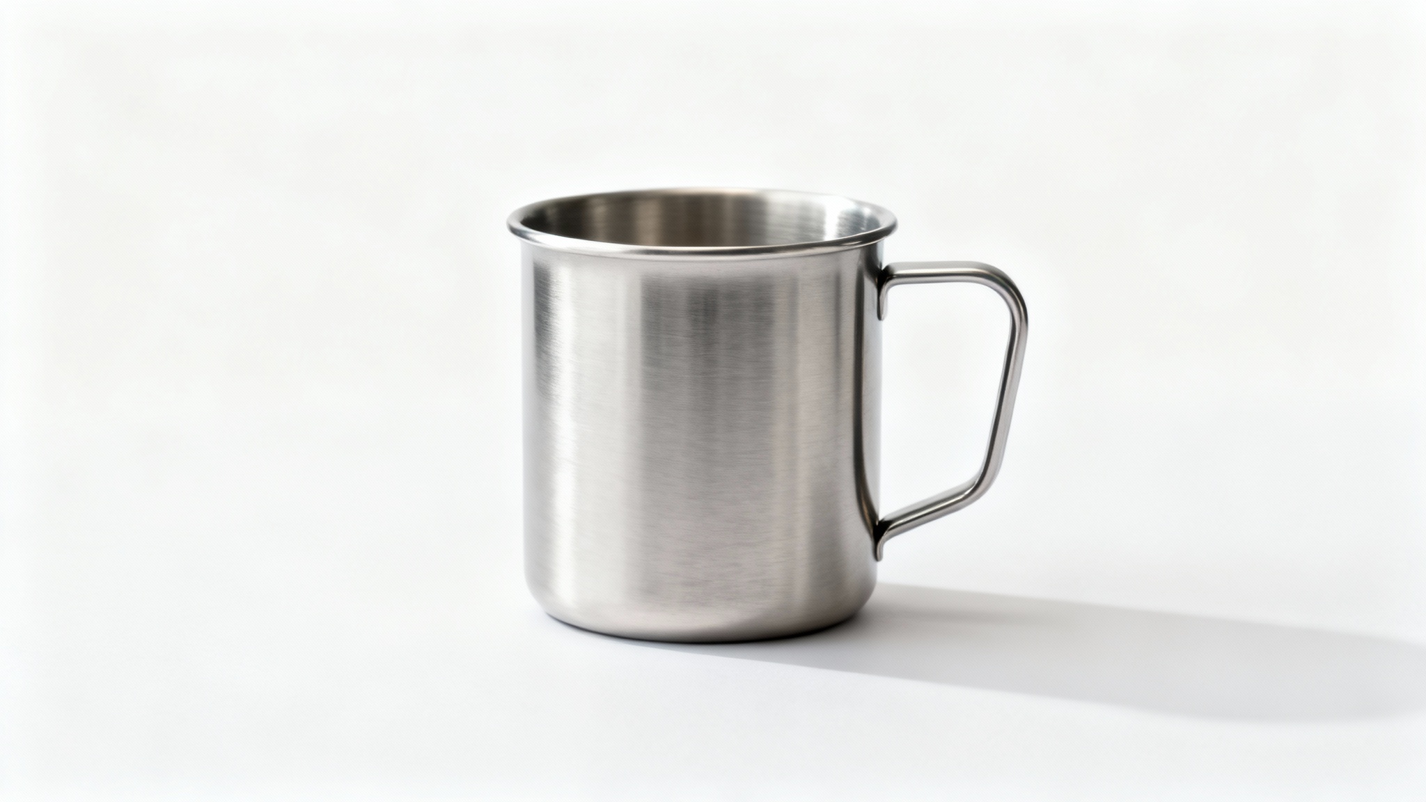 A high-quality mockup image of a modern stainless steel mug with a brushed finish, set against a plain white background.