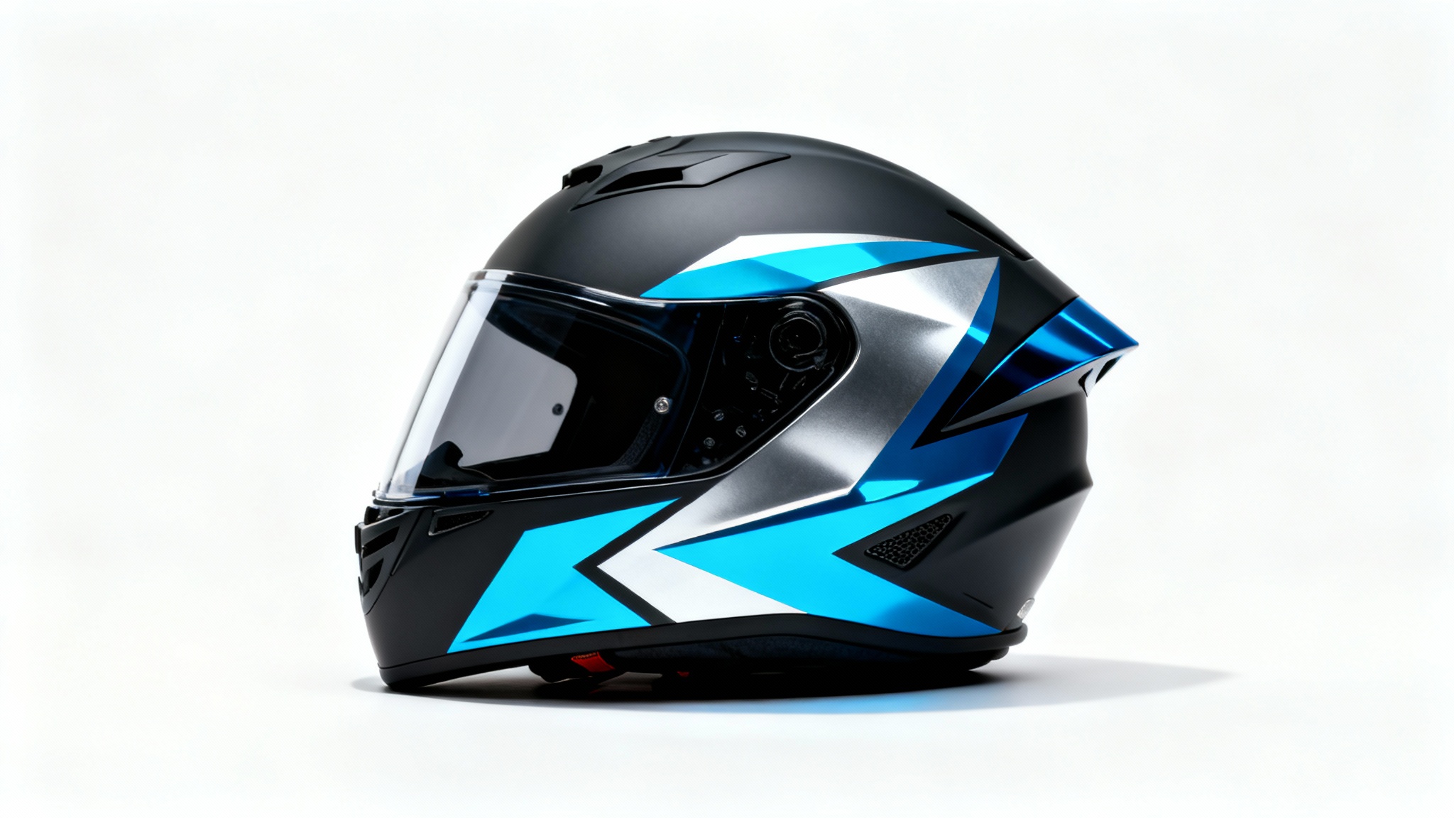 A sleek, modern motorcycle helmet with a matte black finish and a custom electric blue and silver geometric design, photographed against a plain white background.