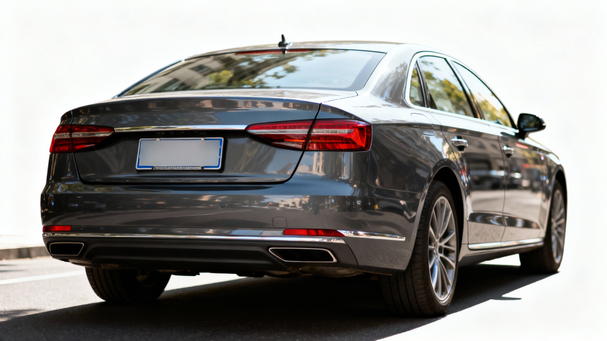 Rear view of a modern dark gray car with its license plate intentionally blurred out to demonstrate a privacy feature, set against a white background.