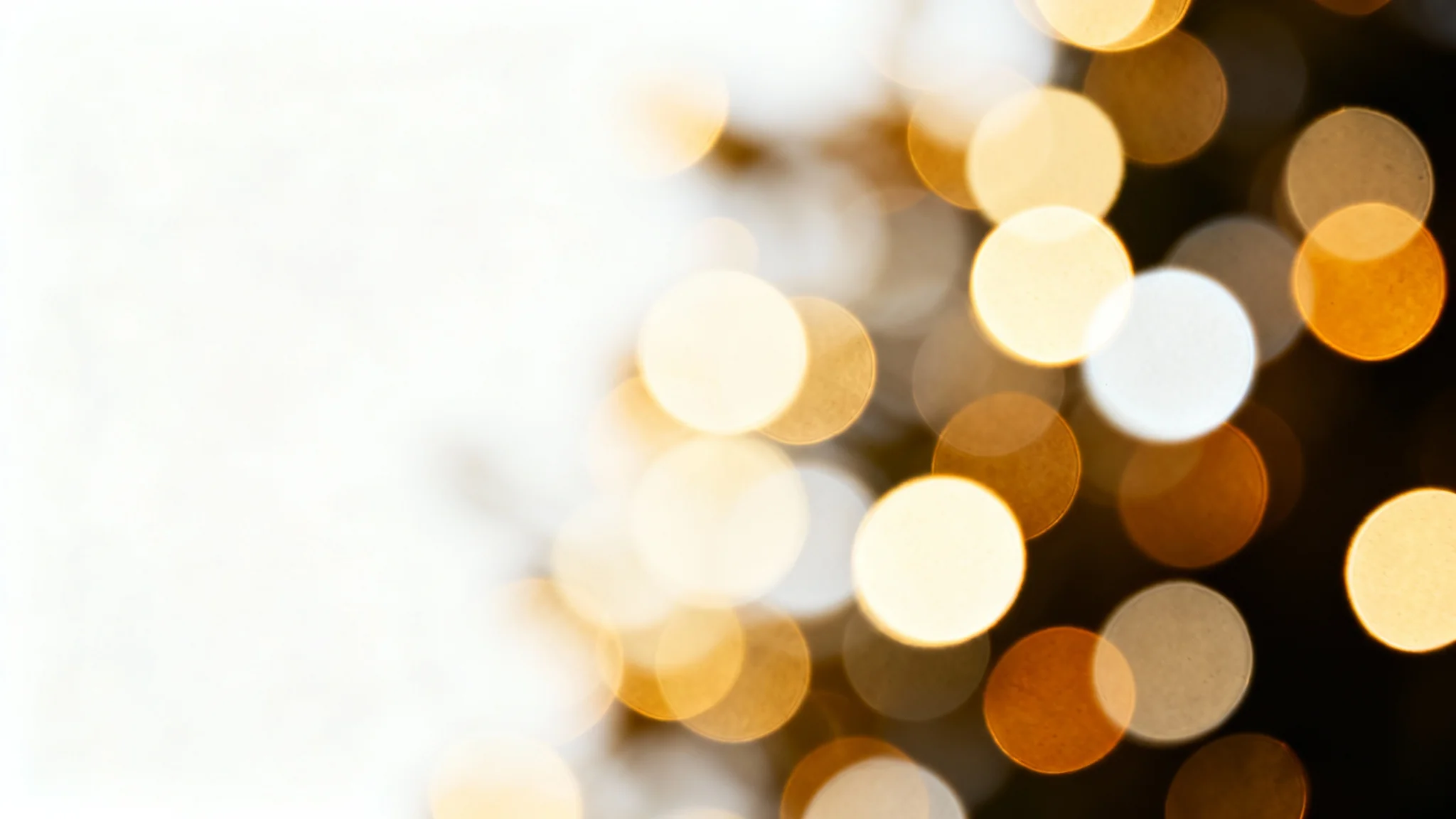 A beautiful abstract image of a bokeh overlay, featuring soft, glowing orbs of golden and white light scattered across a dark background, creating a dreamy and magical effect.