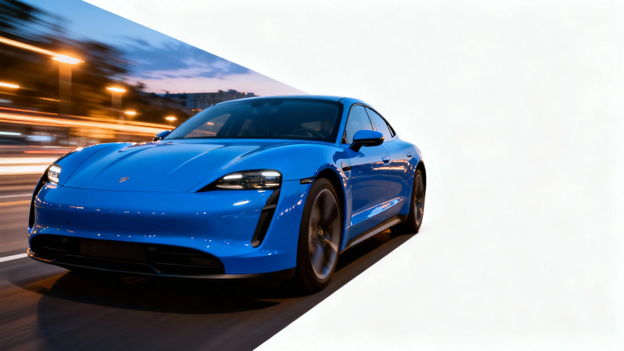 A photograph capturing a sleek electric blue sports car in motion, with the background blurred to convey high speed, set against a clean white backdrop.