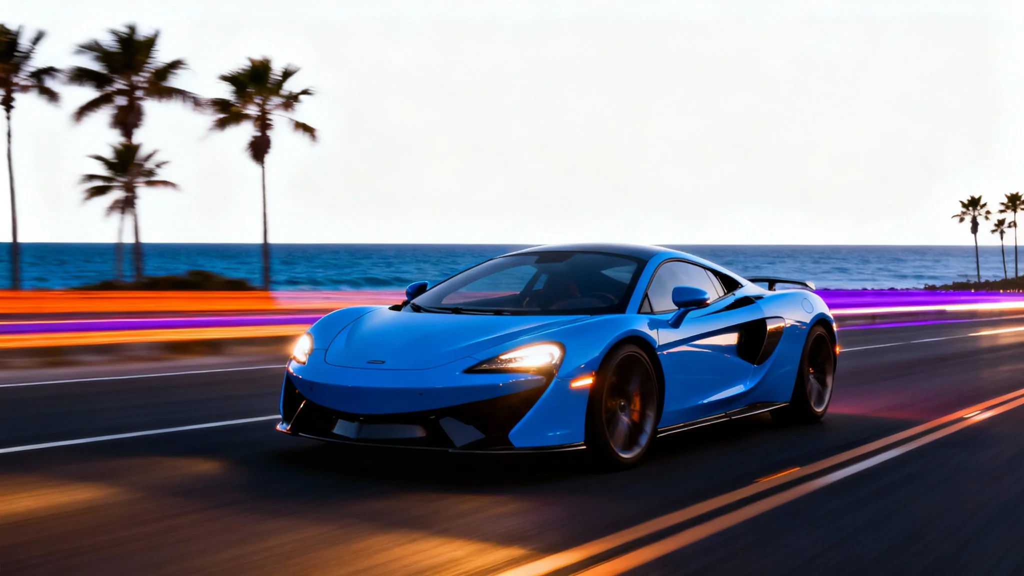 A dynamic image demonstrating motion blur, featuring a sharp, electric blue sports car speeding along a coastal road at twilight, with the background blurred into colorful horizontal streaks. The image is set against a white background.