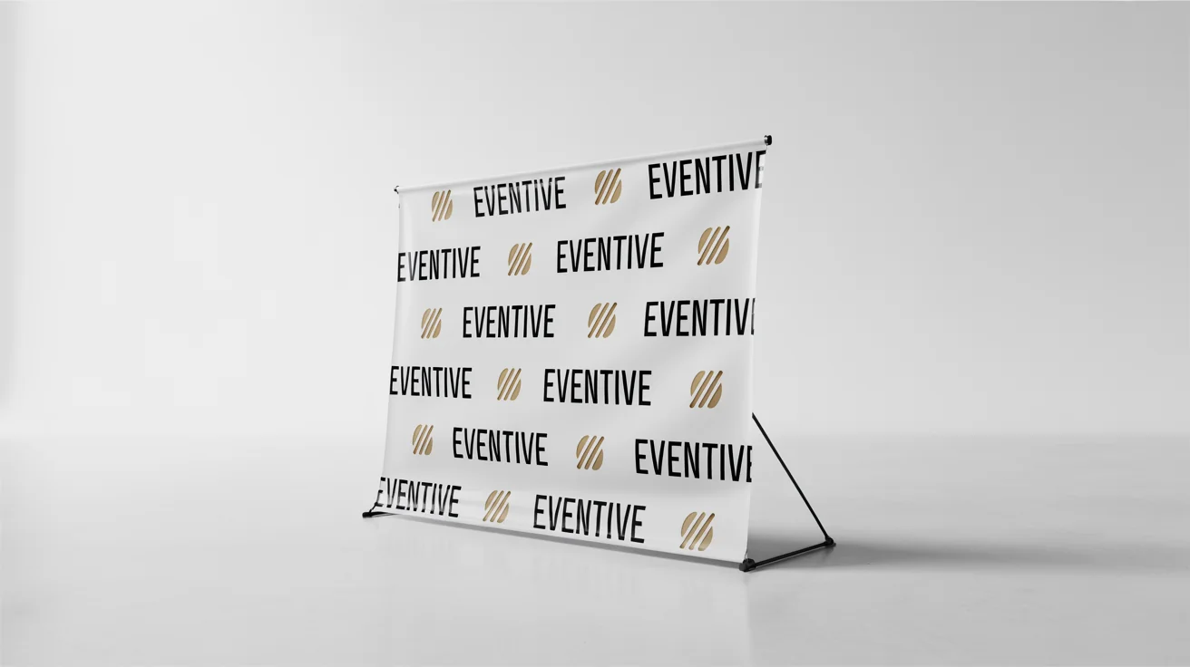 A professional step and repeat banner with a repeating pattern of a fictional 'EVENTIVE' logo and a gold icon, displayed on a stand against a plain white background.