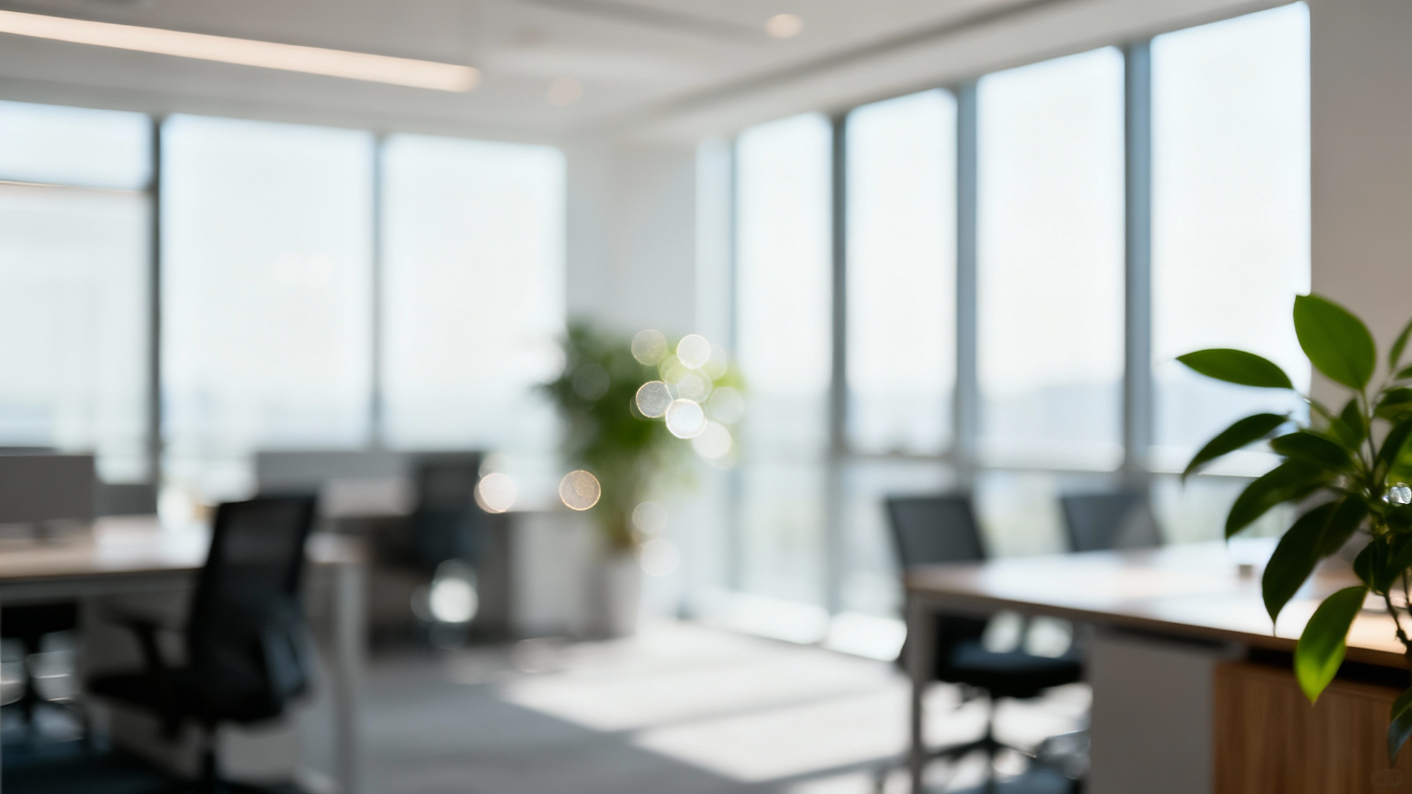 A professional virtual background showing a modern office interior with a heavy blur effect, creating a clean and sophisticated look for video calls.