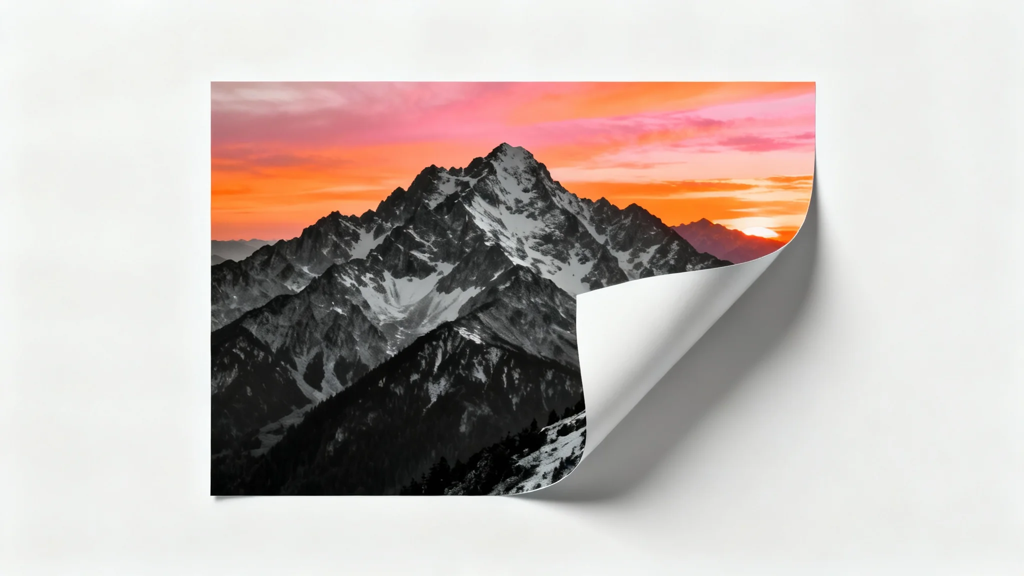 A photo with a black and white filter peeling away to reveal the original, full-color image of a mountain sunset underneath, symbolizing an 'undo' photo edit feature.