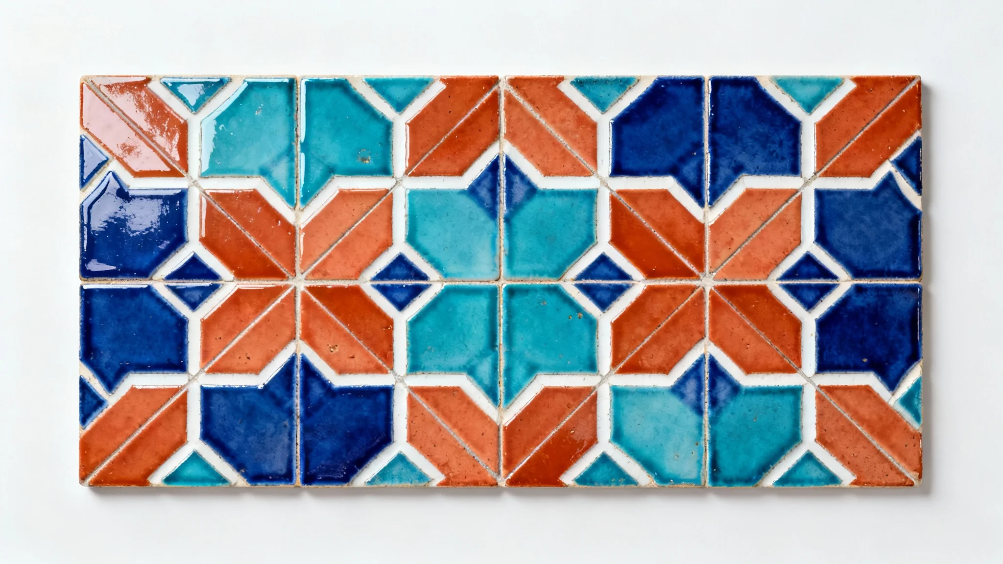 A top-down view of a seamless, repeating pattern of Moroccan Zellige tiles in blue, turquoise, and terracotta on a clean white background.