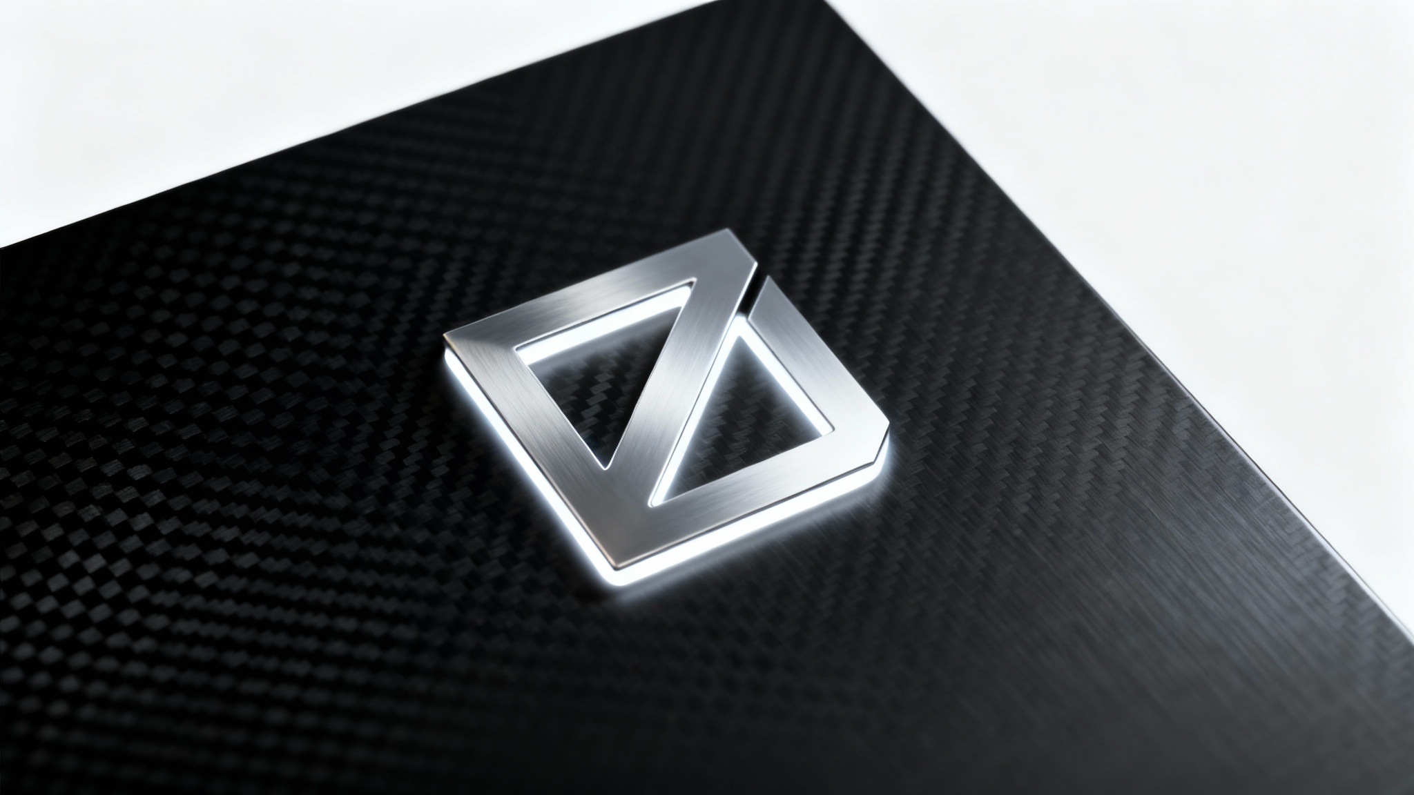 A professional mockup showcasing a glowing silver geometric logo on a textured, premium dark background, emphasizing a high-end look for branding.