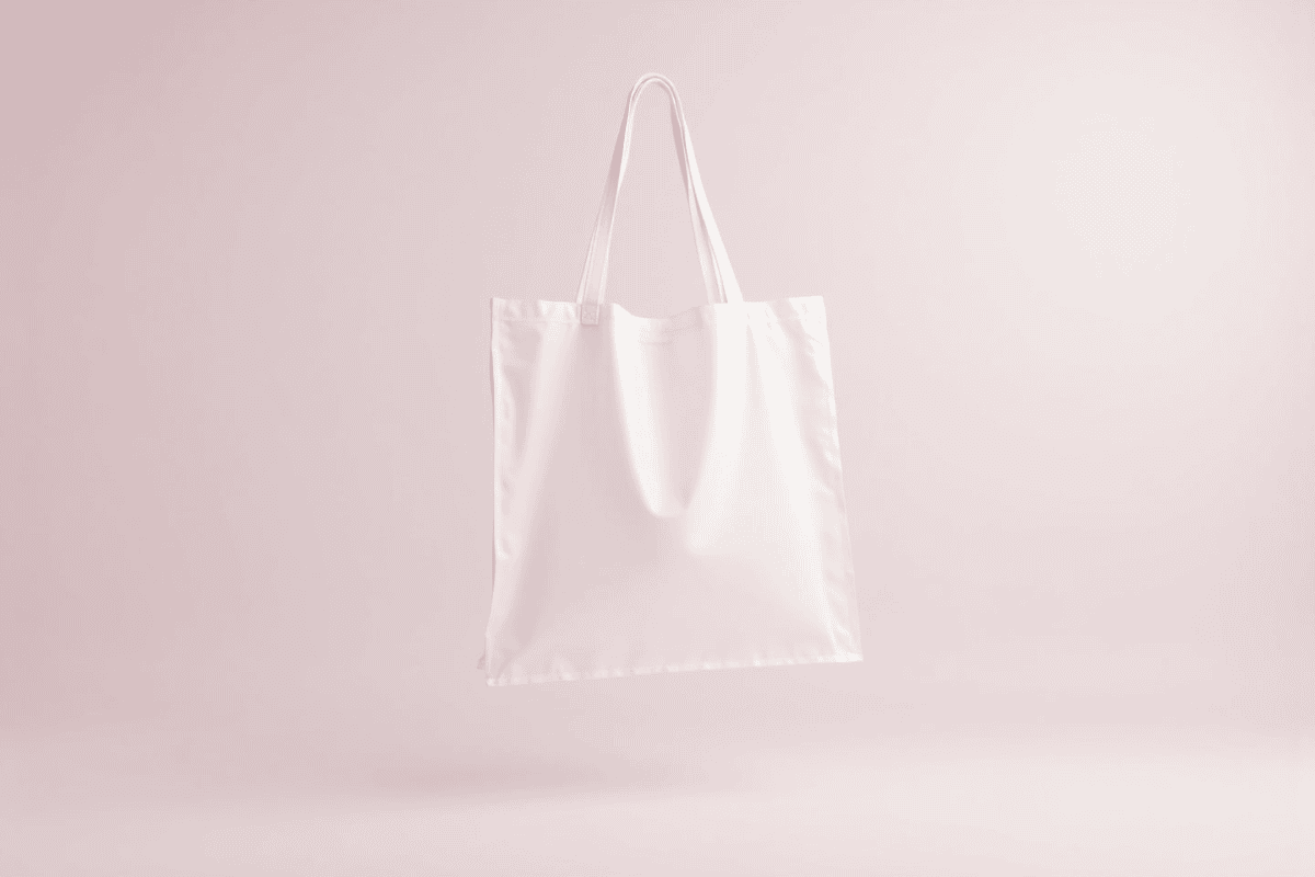 Transparent tote bag mockup in studio background